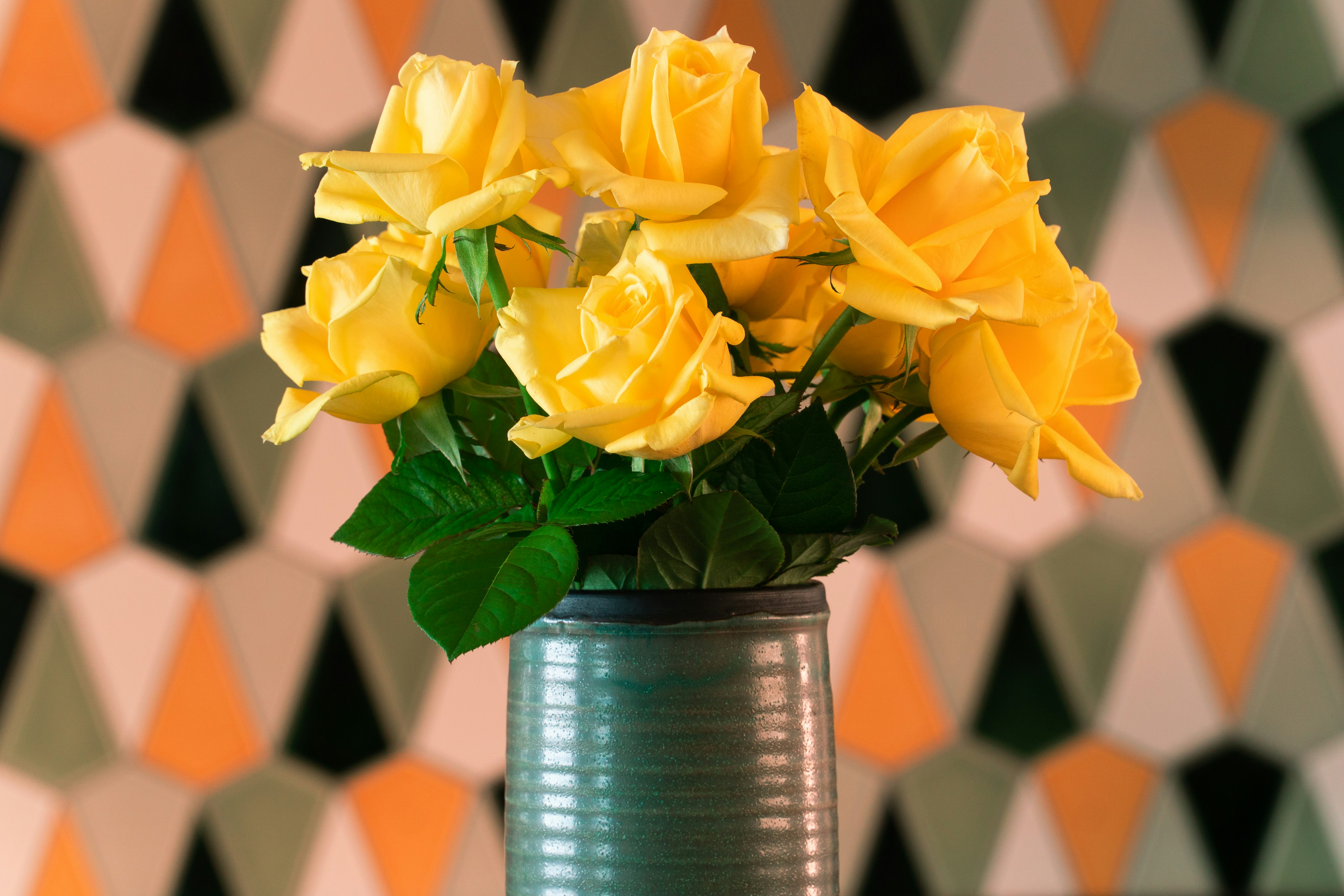 yellow roses in stainless steel bucket